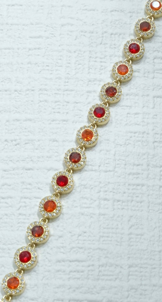 Bracelet doré pierres rouges serties
