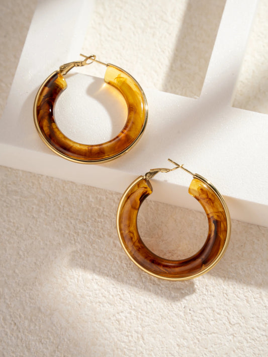 Boucles d’oreilles créoles ambré résine