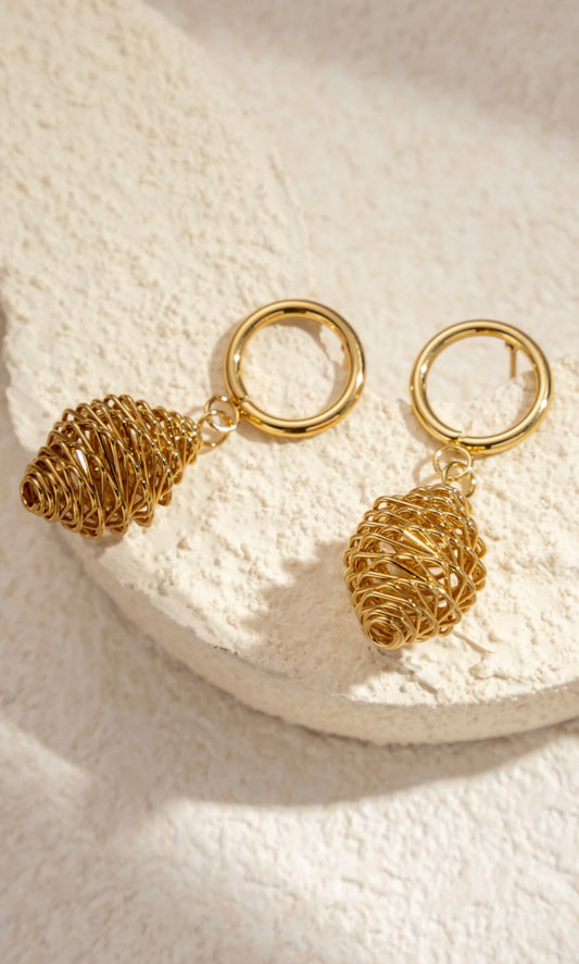 Boucles d'oreilles pendantes ovales en spirale sculptées