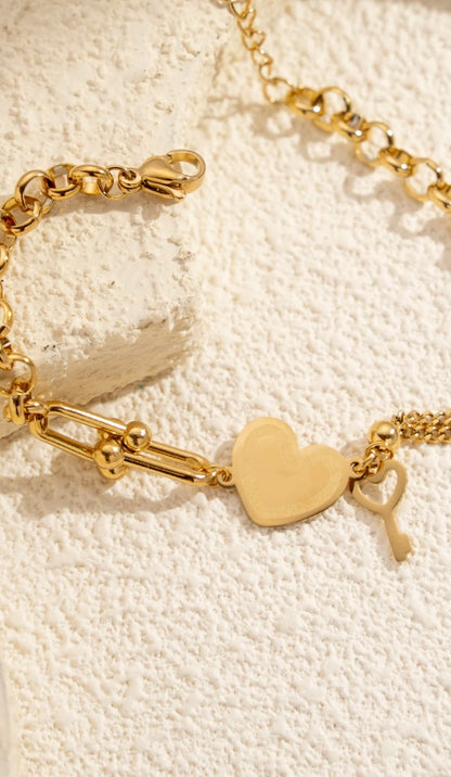 Bracelet doré avec charms cœur & clé